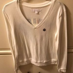 Soft, cream-colored, long sleeve top, size XS.